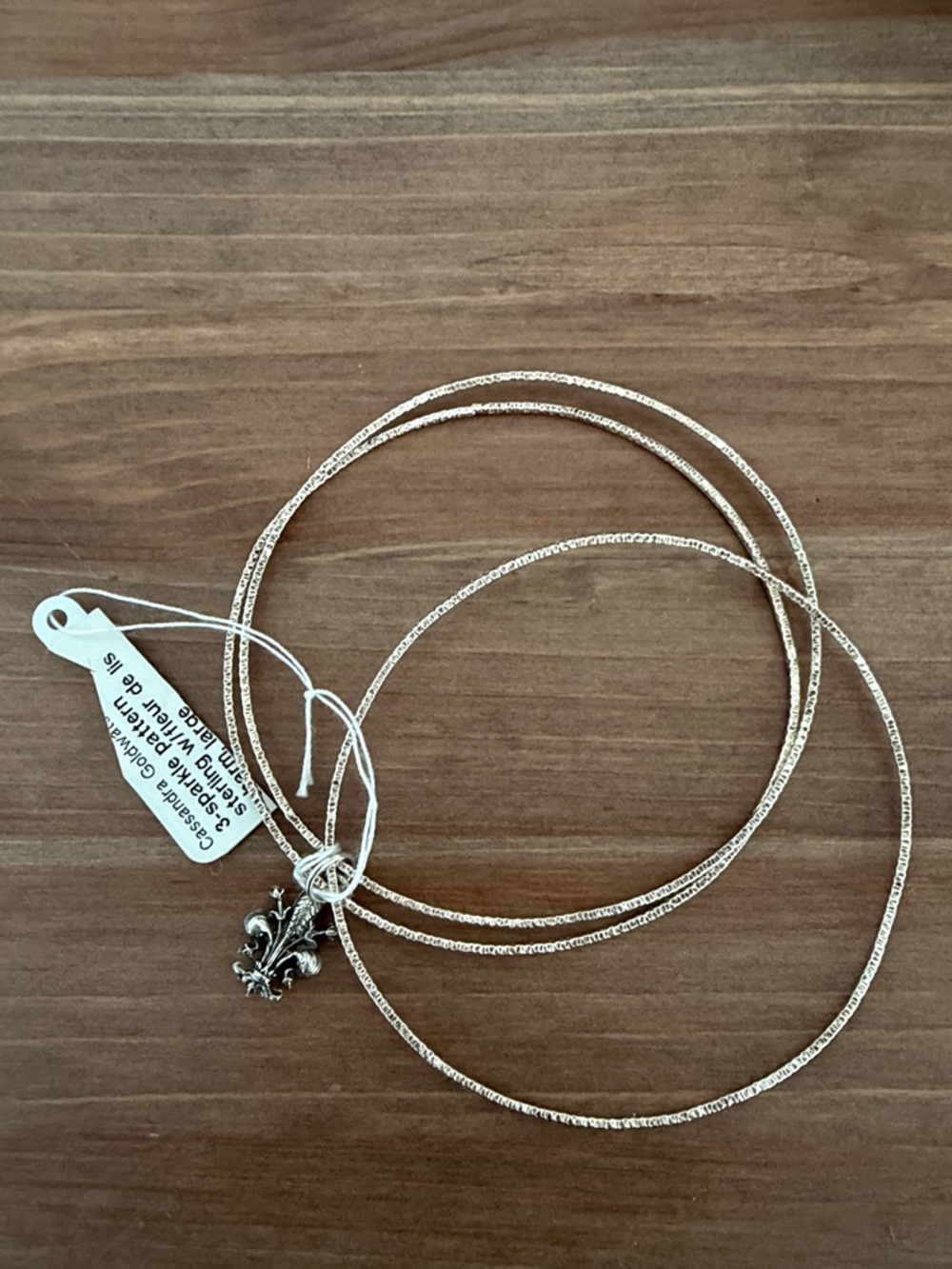 Silver-tone Triple Bangle Bracelet with Fleur-de-lis Charm